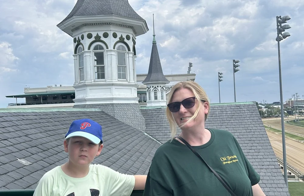 A young fan visiting Churchill Downs with family.